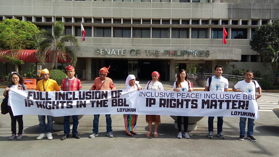 A photo of the indigenous peoples leaders at the Philippine Senate Building holding up a banner saying "IP Rights Matter". Photo by Loyukan